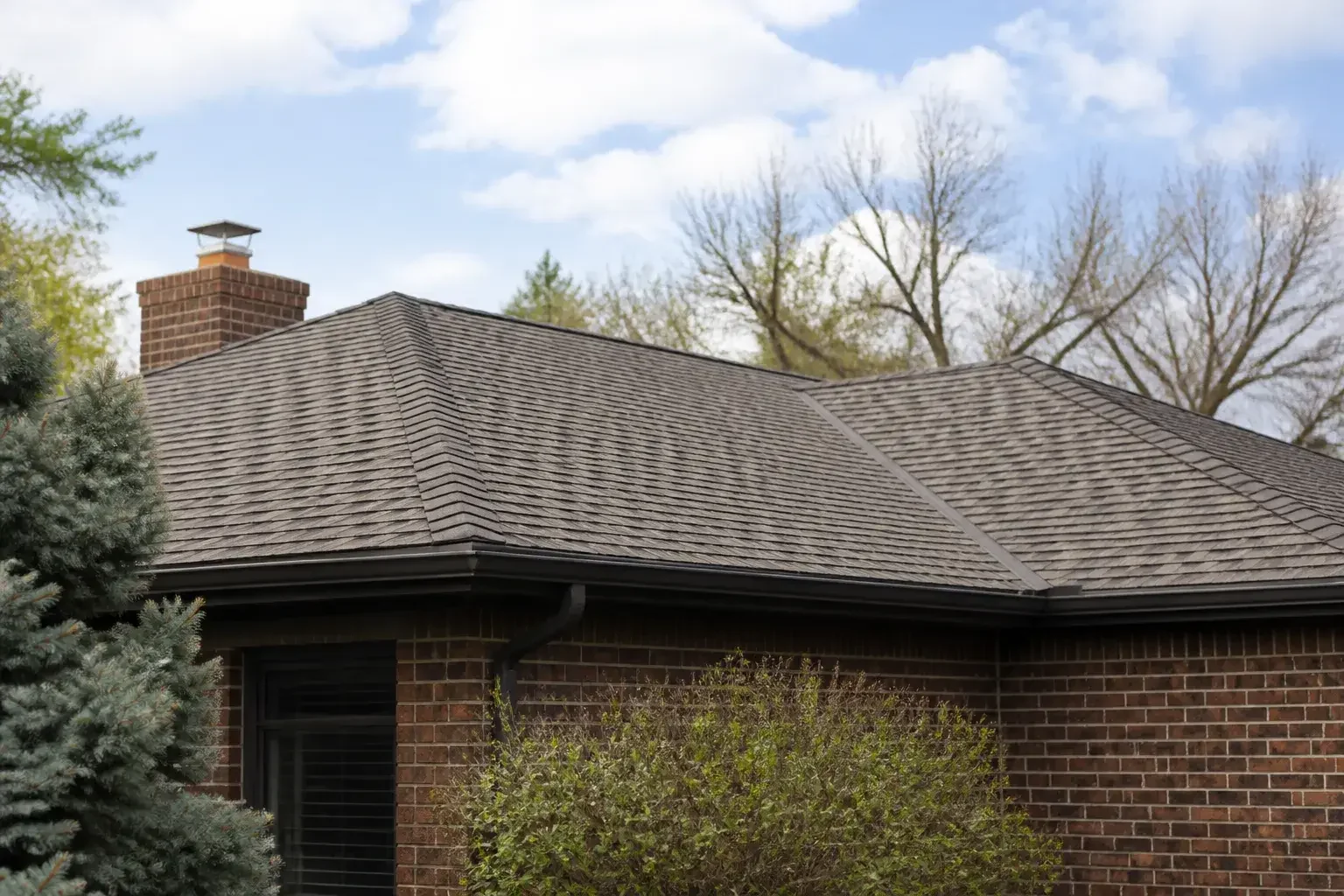 Completed roof repair on a Denver brick home